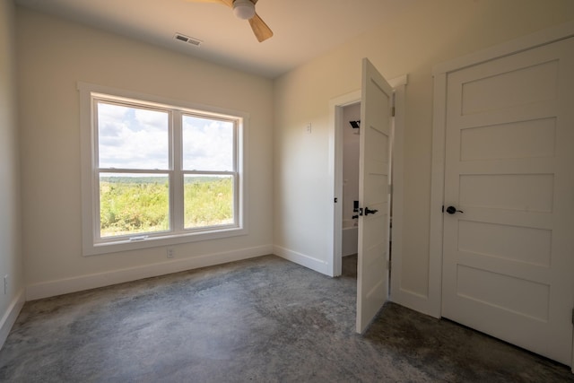 241 Springer, Hohenwald, TN 38462 - unfurnished bedroom with baseboards, dark colored carpet, and ceiling fan