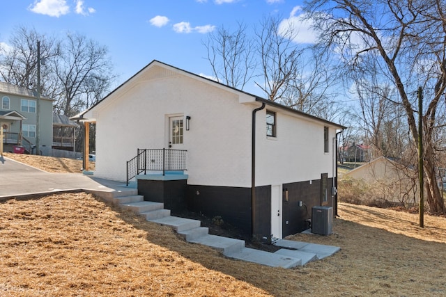 view of property exterior with central air condition unit