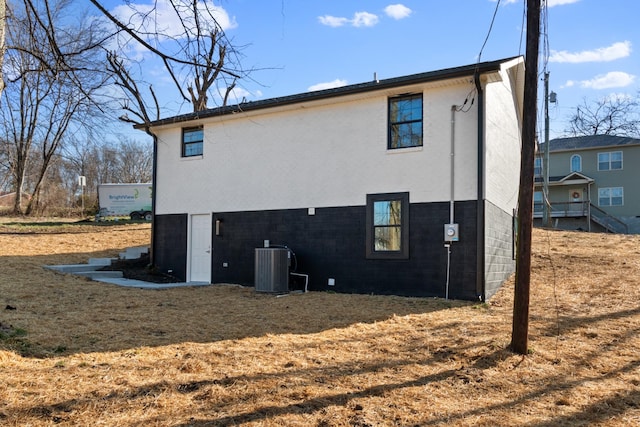 view of side of home with cooling unit