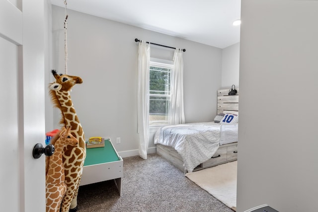 bedroom featuring carpet flooring and baseboards