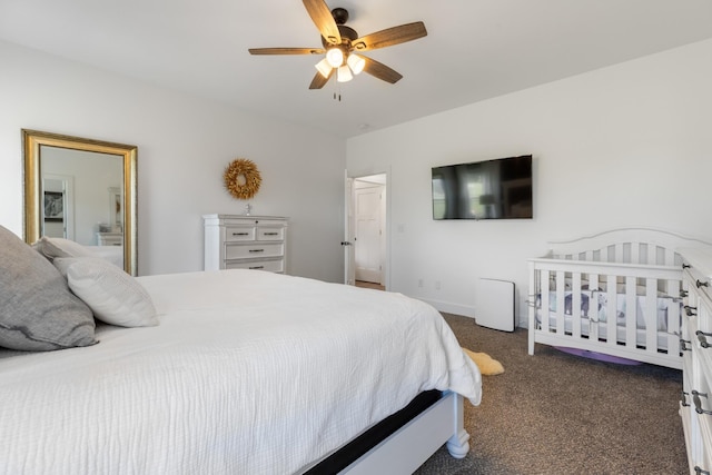 bedroom with baseboards, ceiling fan, and dark carpet