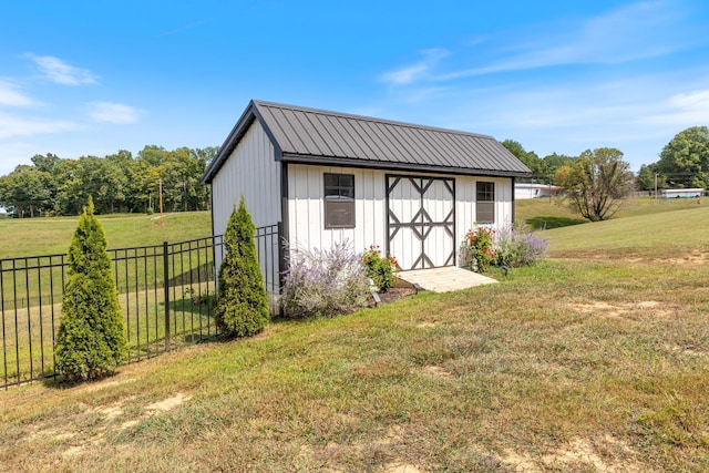 view of shed with fence