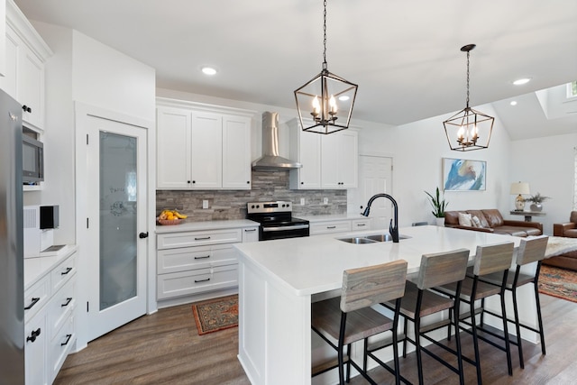 kitchen featuring a sink, dark wood-type flooring, electric stove, wall chimney exhaust hood, and backsplash