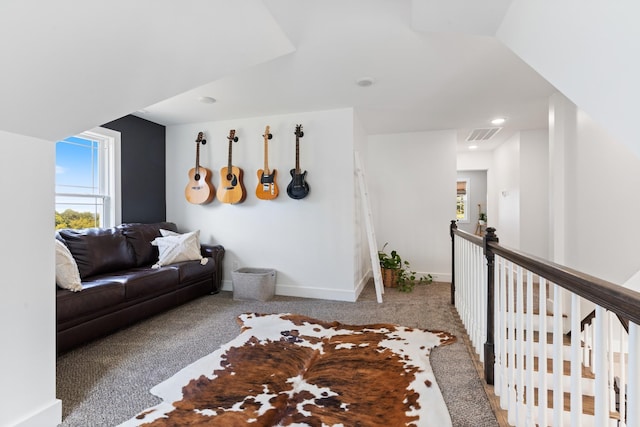 living room with recessed lighting, baseboards, visible vents, and carpet floors