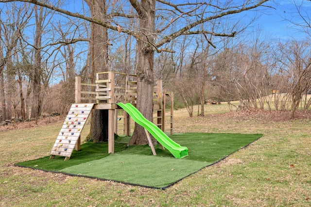 community jungle gym featuring a yard