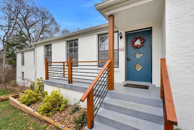 property entrance with brick siding