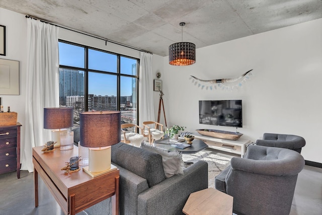 living area featuring finished concrete flooring