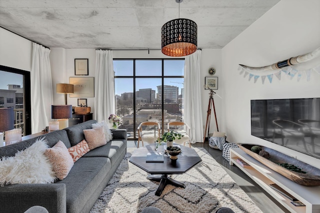 living room with a city view and wood finished floors