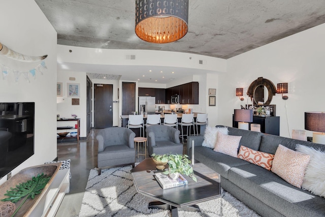 living room with visible vents and finished concrete floors