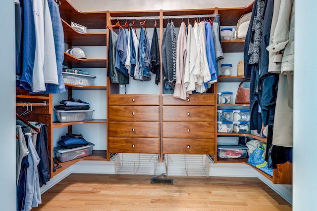 spacious closet featuring wood finished floors