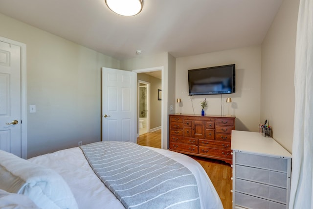 bedroom with wood finished floors