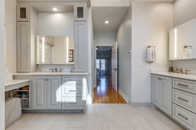 full bathroom with tile patterned floors, recessed lighting, vanity, and baseboards