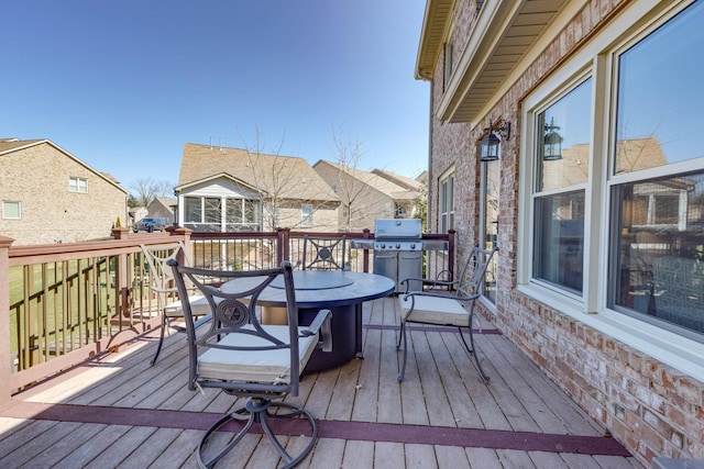 deck with area for grilling and outdoor dining area