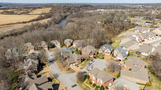 birds eye view of property with a residential view