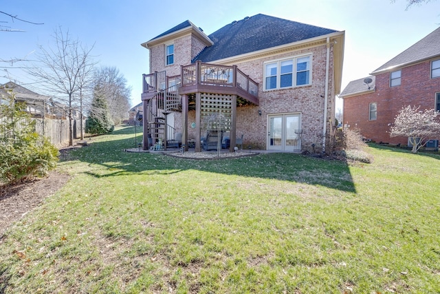 rear view of property featuring stairway, french doors, brick siding, and a wooden deck