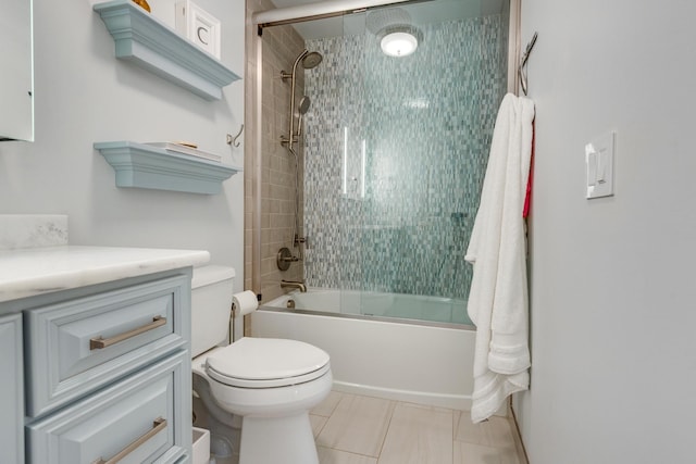 bathroom with tile patterned floors, tub / shower combination, and toilet