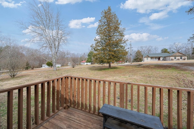 wooden terrace with a lawn