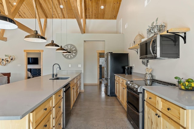 kitchen with beam ceiling, a peninsula, open shelves, a sink, and stainless steel appliances