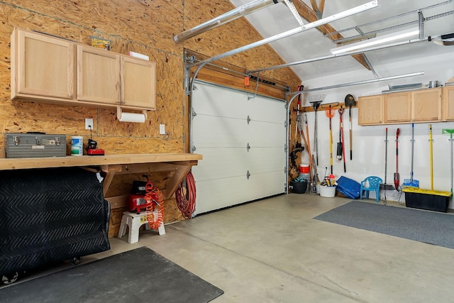 garage featuring a workshop area and a garage door opener