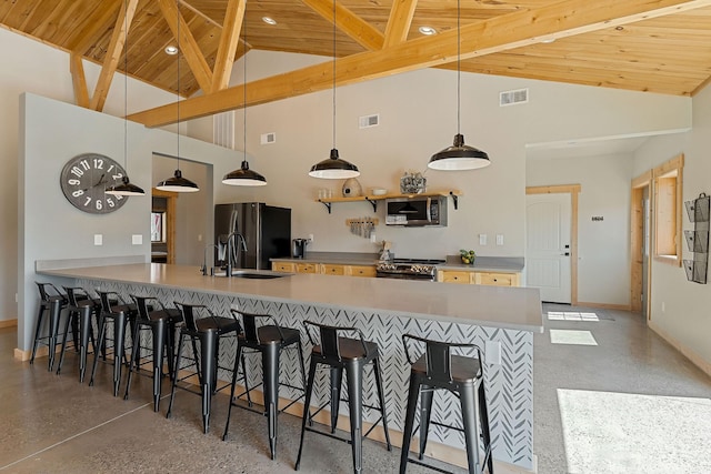 kitchen featuring visible vents, appliances with stainless steel finishes, wooden ceiling, and a sink