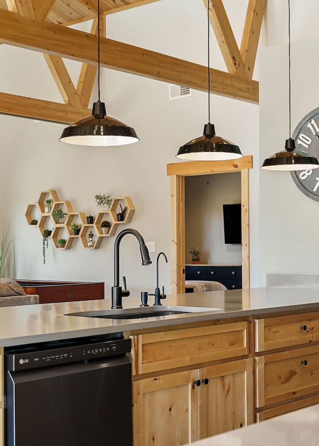 kitchen with dishwashing machine, light brown cabinets, visible vents, lofted ceiling with beams, and a sink