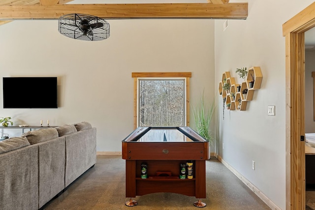 game room with beam ceiling, concrete floors, and baseboards