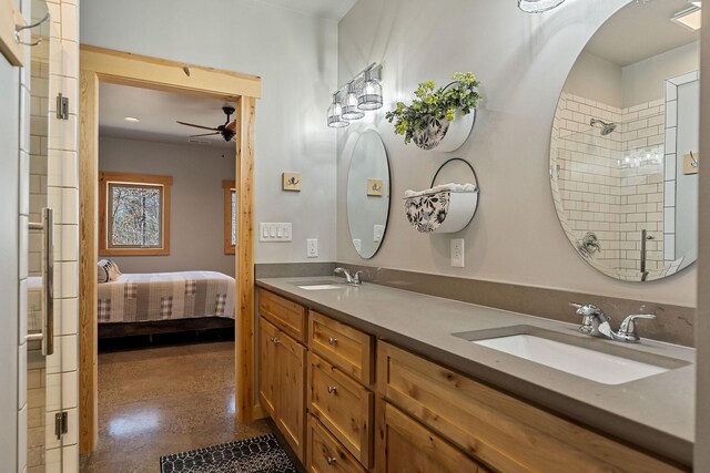 ensuite bathroom featuring a shower, concrete flooring, ceiling fan, and a sink