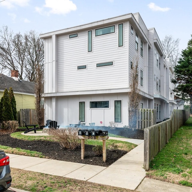 view of front of house with fence