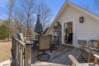 deck with outdoor dining area