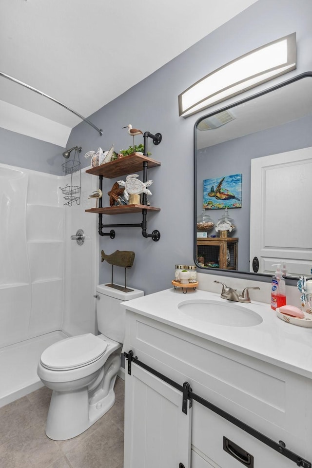 full bathroom featuring vanity, toilet, a shower, and tile patterned flooring