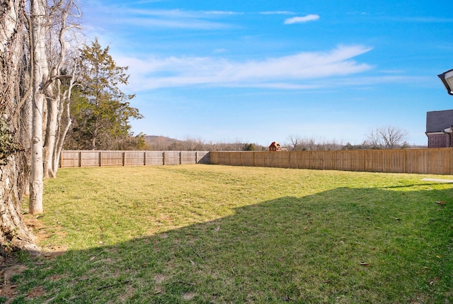 view of yard with a fenced backyard