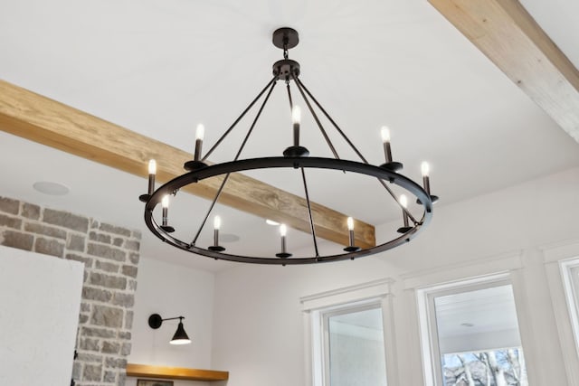 room details featuring beamed ceiling and an inviting chandelier