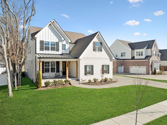 modern farmhouse style home featuring board and batten siding, a porch, concrete driveway, a garage, and a standing seam roof