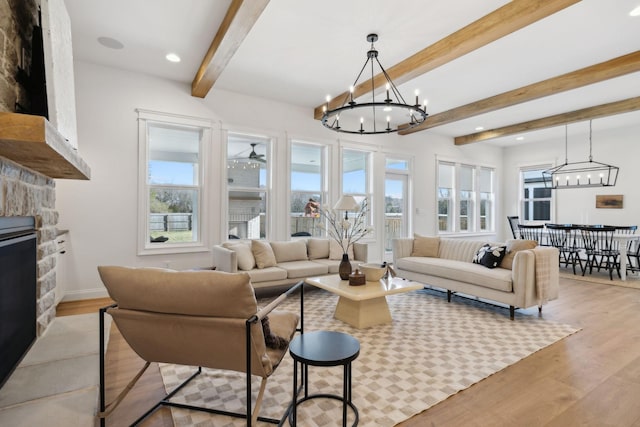 living area with plenty of natural light, light wood-style floors, and a fireplace