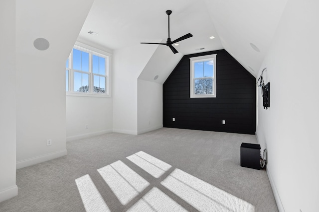 bonus room featuring visible vents, a ceiling fan, baseboards, carpet flooring, and lofted ceiling