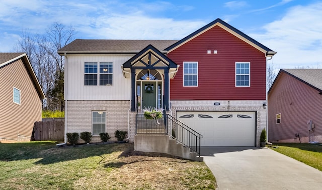 view of front of house with fence, driveway, an attached garage, a front lawn, and brick siding