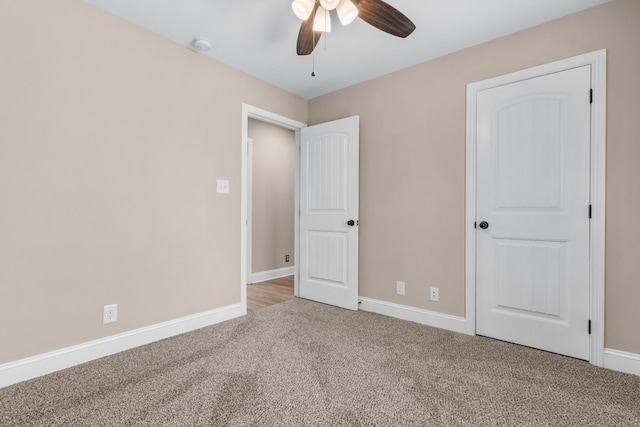 unfurnished bedroom with baseboards, carpet, and ceiling fan