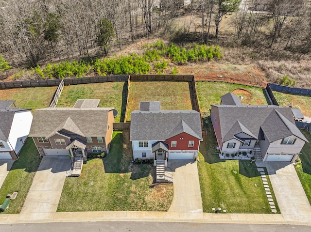 birds eye view of property with a residential view