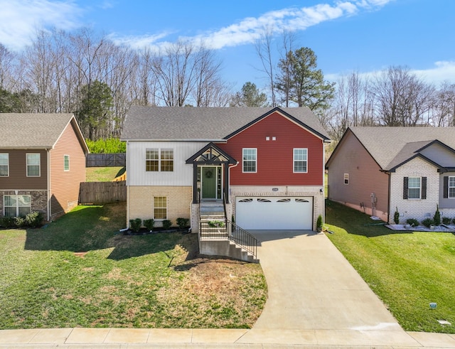 bi-level home featuring a front lawn, fence, concrete driveway, a garage, and brick siding