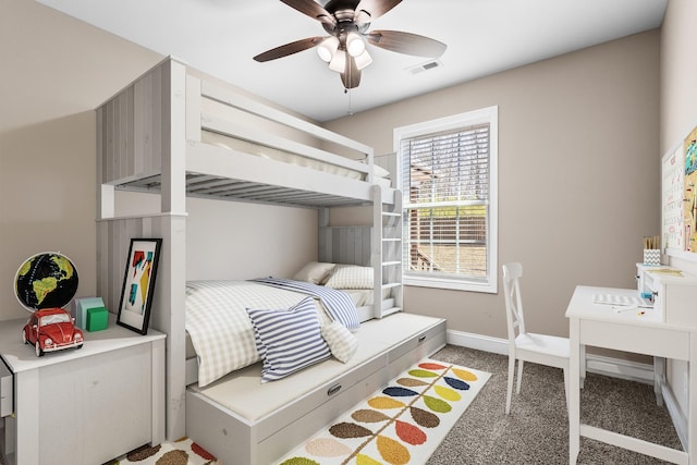 bedroom with visible vents, baseboards, light colored carpet, and ceiling fan