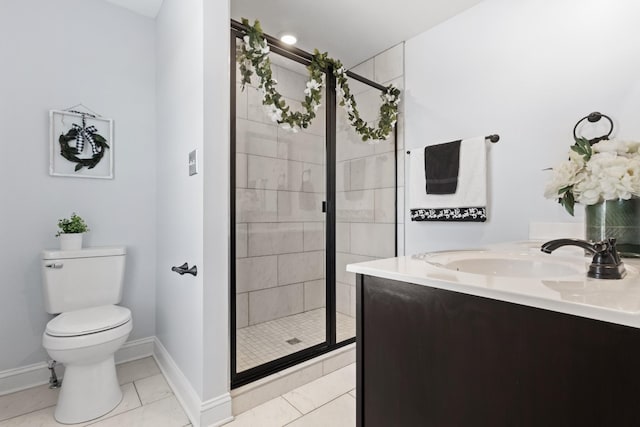 full bathroom featuring baseboards, a sink, a shower stall, tile patterned floors, and toilet