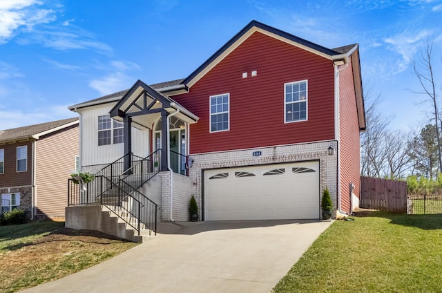 view of front of house with a garage, concrete driveway, a front lawn, and fence