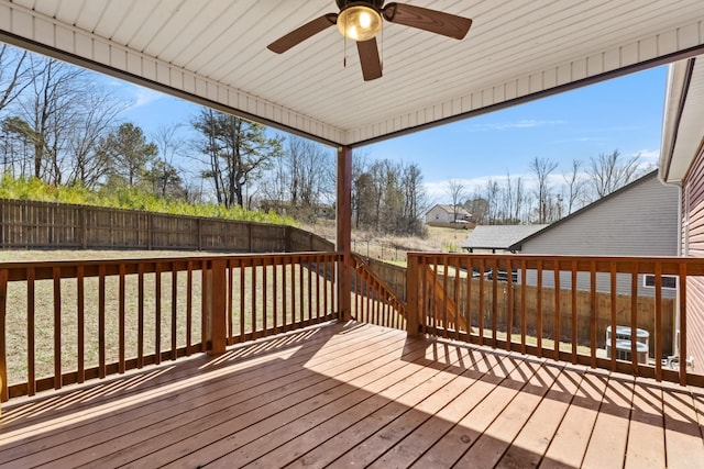 wooden deck featuring a fenced backyard and a ceiling fan