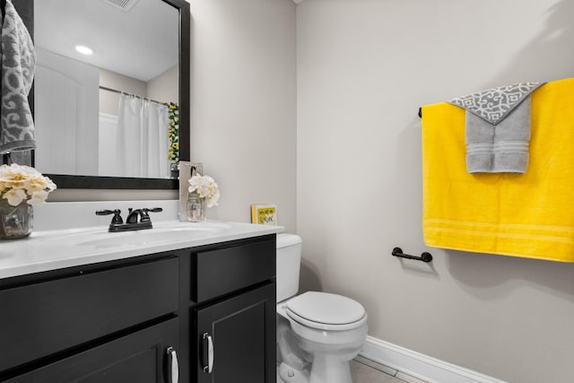 full bath with vanity, baseboards, tile patterned flooring, curtained shower, and toilet