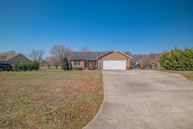 view of front of home featuring brick siding, a garage, concrete driveway, and a front lawn