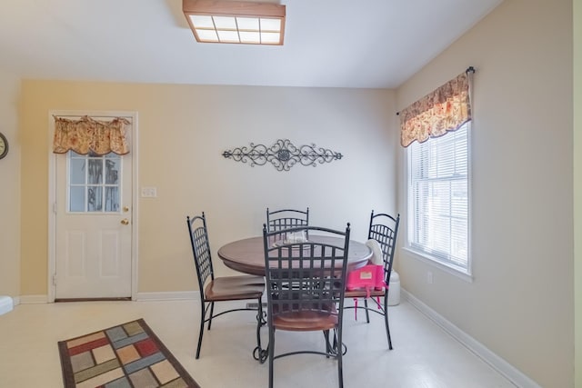 dining room featuring baseboards