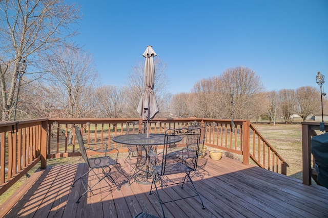 wooden deck with outdoor dining space