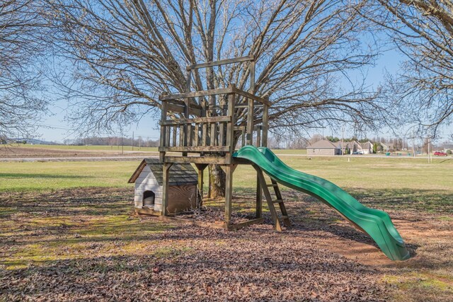 community jungle gym with a lawn