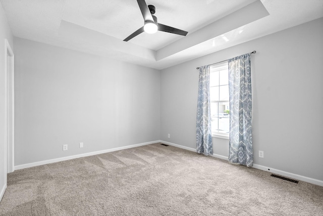 3441 Foxrun Ln, Clarksville, TN 37042 - unfurnished room with visible vents, a raised ceiling, carpet, and baseboards