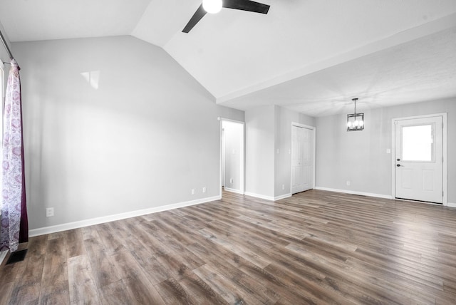3441 Foxrun Ln, Clarksville, TN 37042 - unfurnished living room featuring ceiling fan with notable chandelier, lofted ceiling, baseboards, and wood finished floors